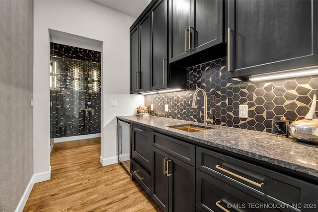 17076 S 31st E Ave, Mounds, OK 74047 - indoor wet bar with light wood-style floors and tasteful backsplash