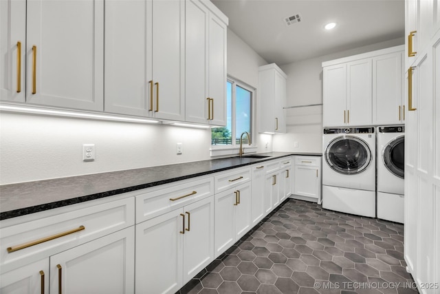 17076 S 31st E Ave, Mounds, OK 74047 - laundry room featuring washing machine and dryer, cabinet space, recessed lighting, and dark tile patterned flooring
