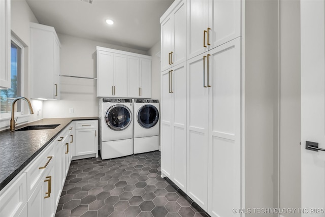 17076 S 31st E Ave, Mounds, OK 74047 - washroom featuring cabinet space, separate washer and dryer, recessed lighting, and dark tile patterned flooring