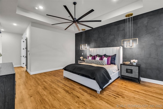 17076 S 31st E Ave, Mounds, OK 74047 - bedroom featuring wood finished floors, recessed lighting, a tray ceiling, and a ceiling fan