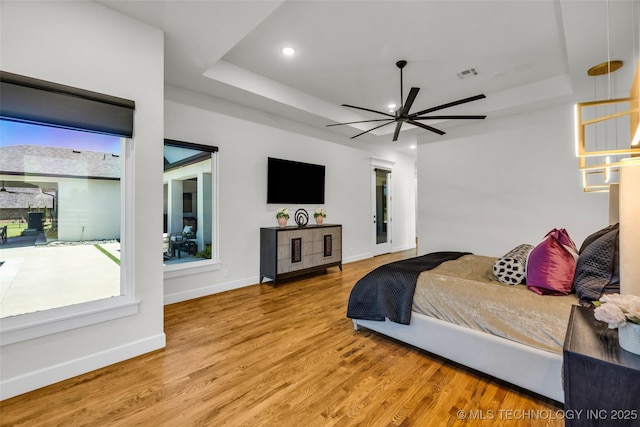 17076 S 31st E Ave, Mounds, OK 74047 - bedroom featuring a tray ceiling, wood finished floors, and recessed lighting