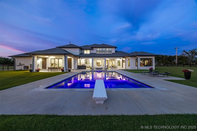 17076 S 31st E Ave, Mounds, OK 74047 - pool at dusk with a patio area, outdoor lounge area, and a diving board
