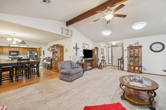 9901 N 107th E Ave, Owasso, OK 74055 - living area featuring light colored carpet, ceiling fan, a chandelier, and a textured ceiling