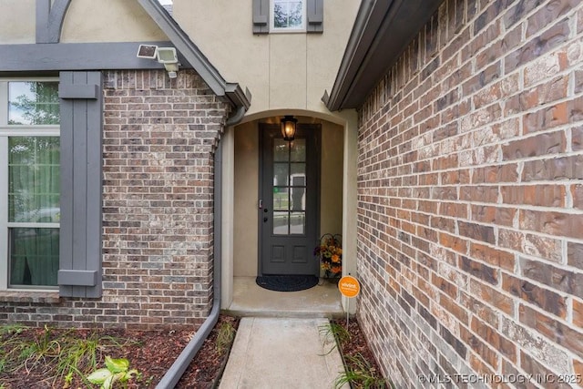2610 E 139th St S, Jenks, OK 74008 - view of exterior entry featuring brick siding and stucco siding