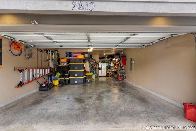2610 E 139th St S, Jenks, OK 74008 - garage with stainless steel fridge