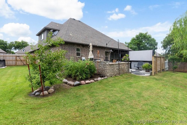 2610 E 139th St S, Jenks, OK 74008 - back of house featuring a fenced backyard, roof with shingles, and brick siding