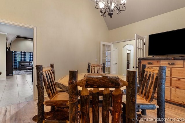 2610 E 139th St S, Jenks, OK 74008 - dining room with a chandelier, high vaulted ceiling, and arched walkways