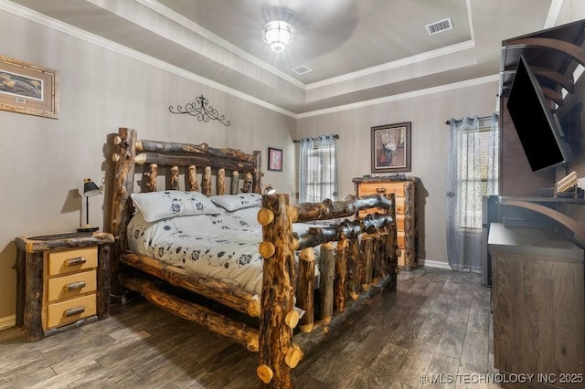2610 E 139th St S, Jenks, OK 74008 - bedroom with hardwood / wood-style flooring, multiple windows, a raised ceiling, and ornamental molding