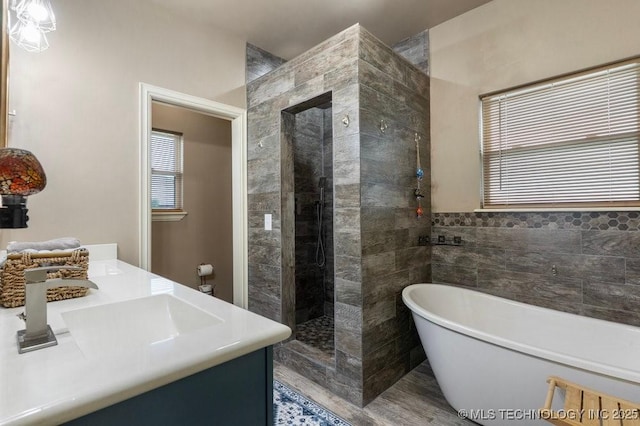 2610 E 139th St S, Jenks, OK 74008 - bathroom featuring a soaking tub, walk in shower, and double vanity