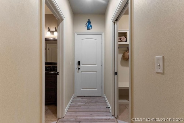 2610 E 139th St S, Jenks, OK 74008 - doorway featuring light wood-style flooring and a sink