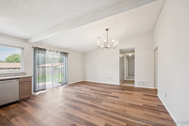 208 183rd E Ave, Tulsa, OK 74108 - unfurnished dining area featuring a chandelier, a textured ceiling, wood finished floors, and beam ceiling