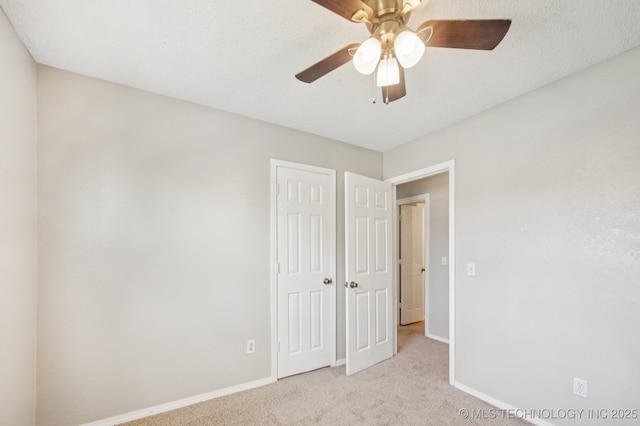 208 183rd E Ave, Tulsa, OK 74108 - unfurnished bedroom with carpet, a closet, and a ceiling fan