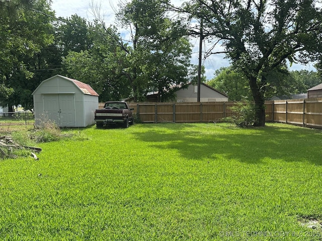 1208 S 9th, Mcalester, OK 74501 - fenced backyard with a storage shed