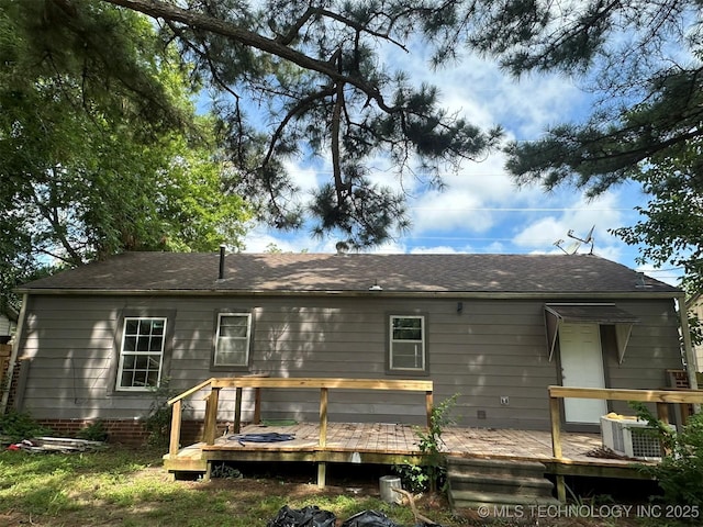 1208 S 9th, Mcalester, OK 74501 - rear view of house with a wooden deck and a shingled roof