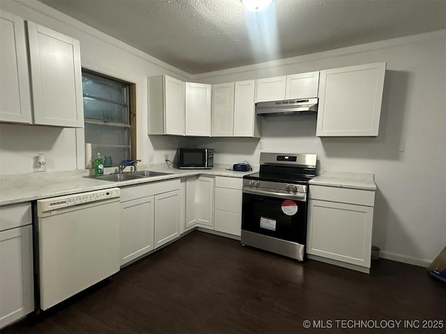 1208 S 9th, Mcalester, OK 74501 - kitchen featuring electric range, white dishwasher, black microwave, under cabinet range hood, and light countertops