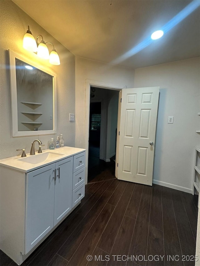 1208 S 9th, Mcalester, OK 74501 - bathroom featuring wood finished floors and vanity