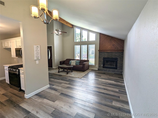 605 W 18th St S, Claremore, OK 74019 - living room featuring a brick fireplace, ceiling fan, high vaulted ceiling, a chandelier, and dark wood-style flooring