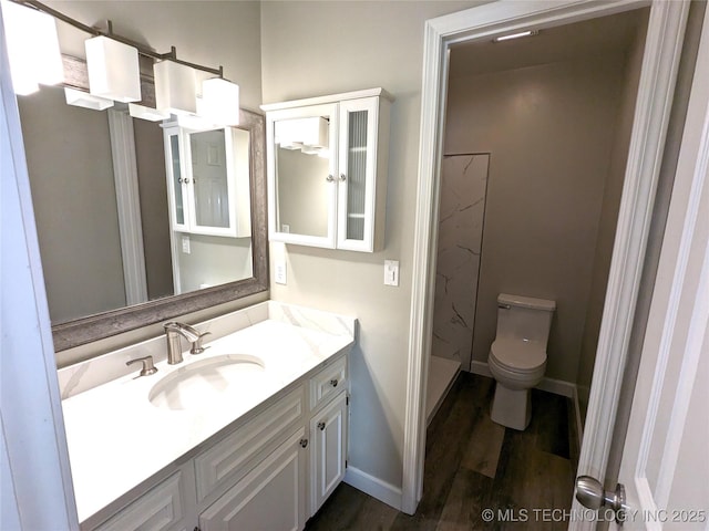 605 W 18th St S, Claremore, OK 74019 - full bath featuring vanity, wood finished floors, and a shower