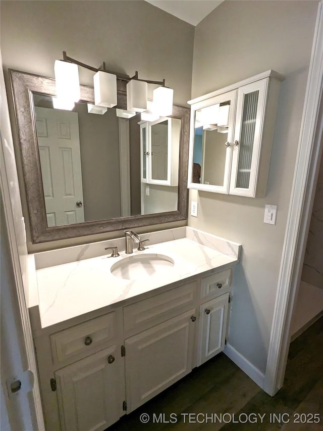 605 W 18th St S, Claremore, OK 74019 - bathroom featuring vanity and wood finished floors