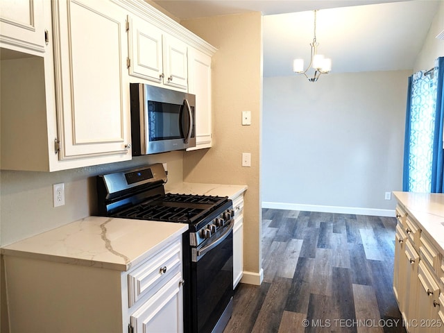 605 W 18th St S, Claremore, OK 74019 - kitchen with stainless steel appliances, dark wood finished floors, a chandelier, light stone countertops, and white cabinets