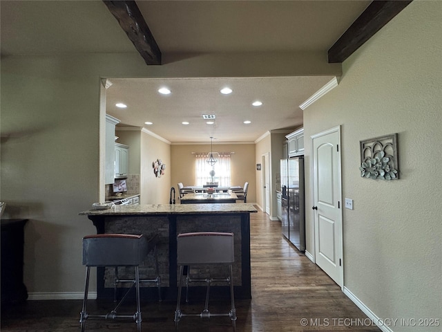 21902 W 13th St S, Sand Springs, OK 74063 - kitchen with crown molding, freestanding refrigerator, a breakfast bar area, white cabinetry, and recessed lighting