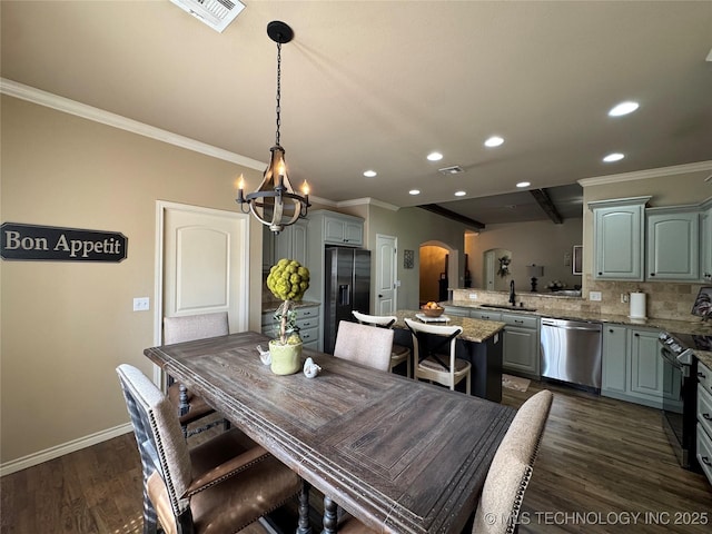 21902 W 13th St S, Sand Springs, OK 74063 - dining area with arched walkways, a chandelier, recessed lighting, crown molding, and dark wood-style floors