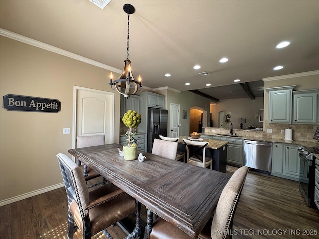 21902 W 13th St S, Sand Springs, OK 74063 - dining space featuring arched walkways, ornamental molding, recessed lighting, a chandelier, and dark wood-style flooring