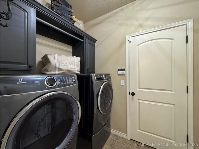 21902 W 13th St S, Sand Springs, OK 74063 - washroom with washing machine and clothes dryer, tile patterned floors, and cabinet space