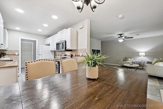 3948 S 93rd E Ave, Tulsa, OK 74145 - dining room featuring a ceiling fan, light wood finished floors, and recessed lighting