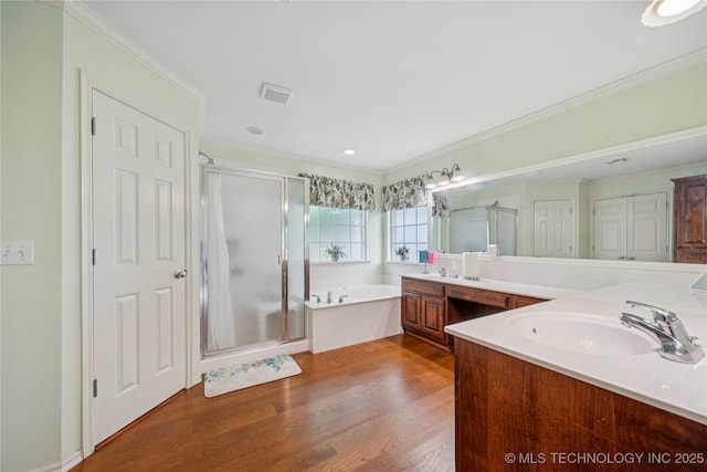 7440 E Indianola St, Broken Arrow, OK 74014 - full bath with a stall shower, double vanity, a garden tub, wood finished floors, and ornamental molding