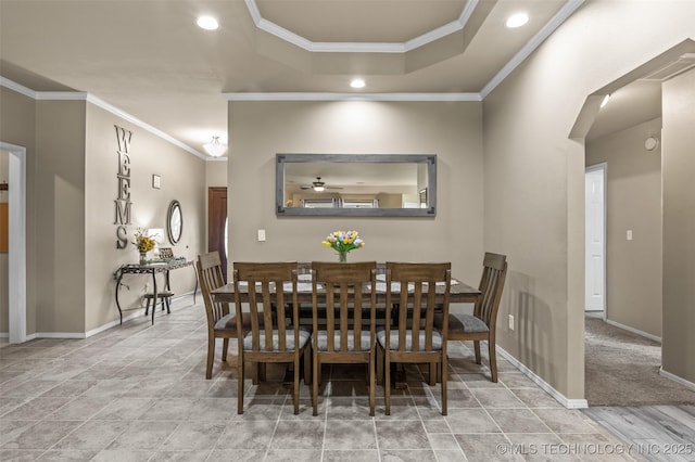 14908 E 88th St, Owasso, OK 74055 - dining space featuring crown molding, recessed lighting, a tray ceiling, and arched walkways