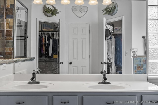 14908 E 88th St, Owasso, OK 74055 - bathroom featuring double vanity and a walk in closet