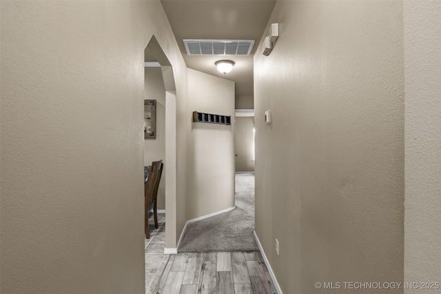 14908 E 88th St, Owasso, OK 74055 - corridor featuring wood finished floors and baseboards