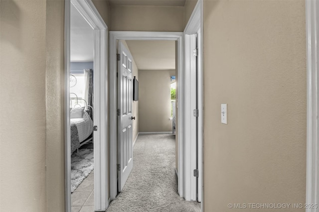 14908 E 88th St, Owasso, OK 74055 - hallway with light colored carpet and baseboards
