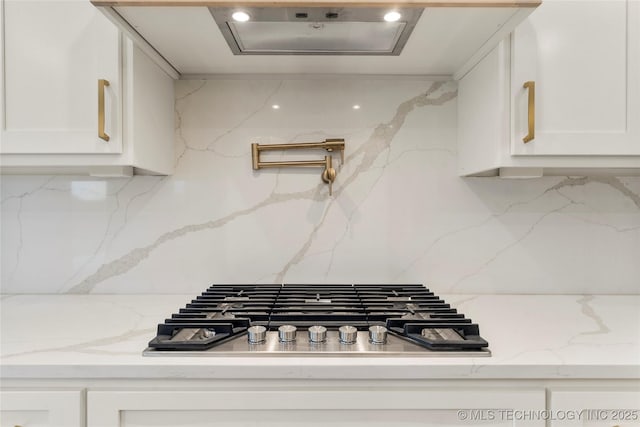 2985 E 146th St S, Bixby, OK 74008 - kitchen featuring stainless steel gas cooktop, backsplash, white cabinetry, light stone counters, and recessed lighting