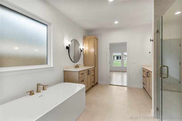 2985 E 146th St S, Bixby, OK 74008 - bathroom featuring vanity, a freestanding bath, a shower stall, recessed lighting, and tile patterned floors