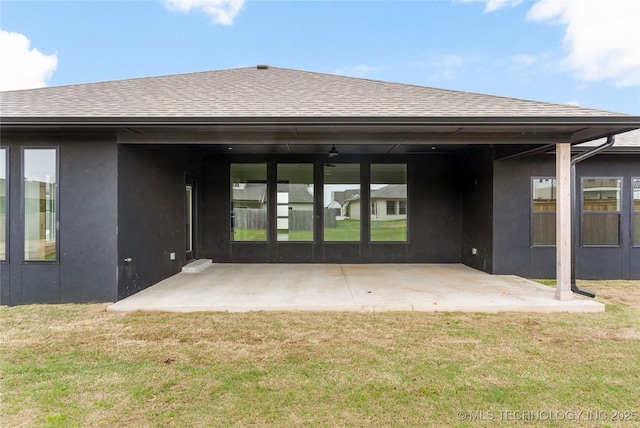 2985 E 146th St S, Bixby, OK 74008 - rear view of house featuring roof with shingles, a lawn, stucco siding, and a patio area
