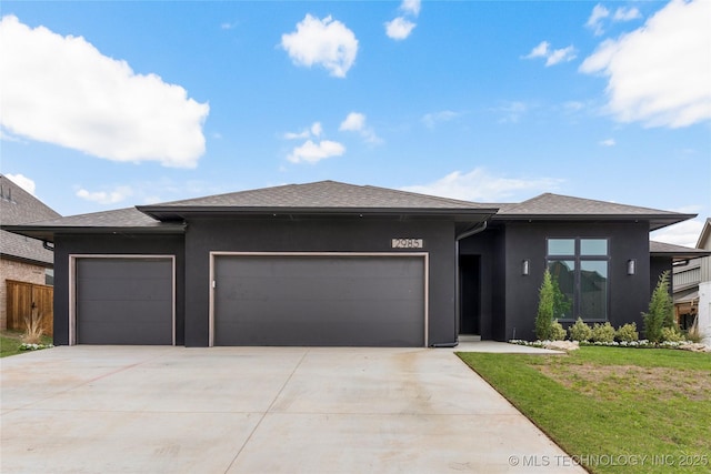 2985 E 146th St S, Bixby, OK 74008 - prairie-style house with a garage, driveway, a front yard, and stucco siding