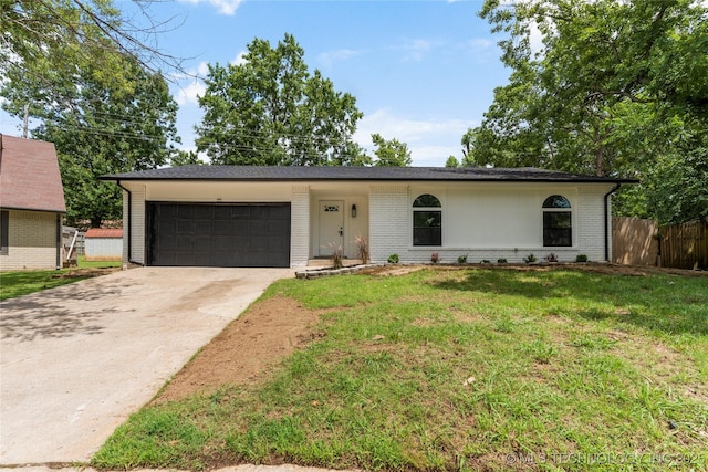 101 W Waco Pl, Broken Arrow, OK 74011 - ranch-style house with an attached garage, brick siding, and driveway