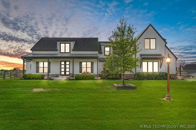 19021 E Chokeberry St, Owasso, OK 74055 - rear view of house featuring a standing seam roof, french doors, a metal roof, and stucco siding