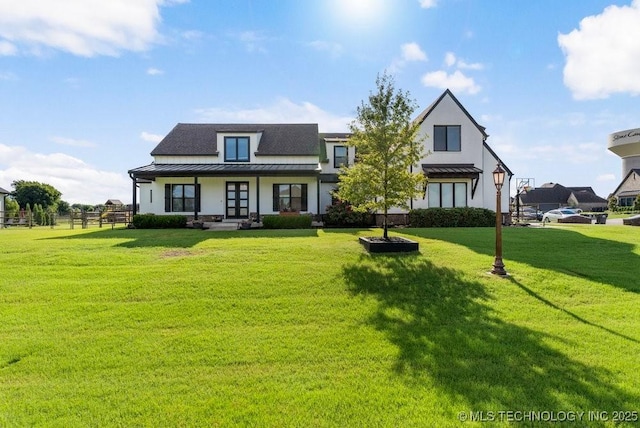 19021 E Chokeberry St, Owasso, OK 74055 - view of front of home featuring a standing seam roof, a porch, a front yard, and stucco siding