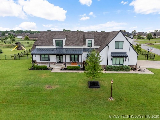 19021 E Chokeberry St, Owasso, OK 74055 - back of house with french doors, a standing seam roof, roof with shingles, stucco siding, and a playground