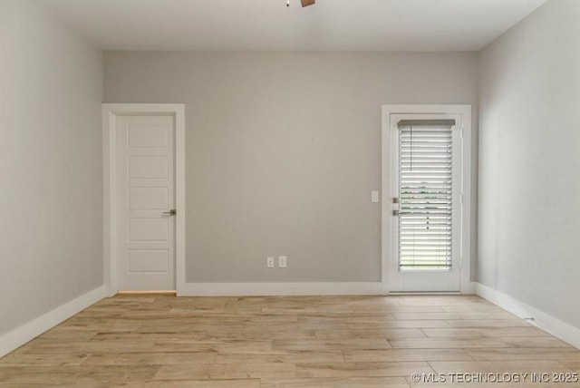 19021 E Chokeberry St, Owasso, OK 74055 - empty room with light wood-style floors and baseboards