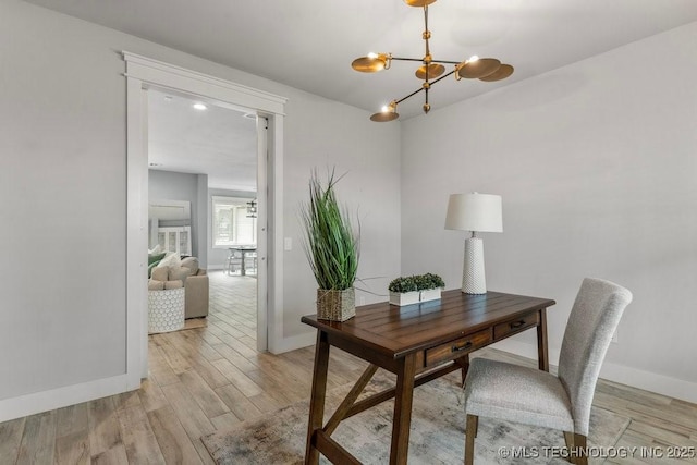 19021 E Chokeberry St, Owasso, OK 74055 - office with a chandelier and light wood-type flooring