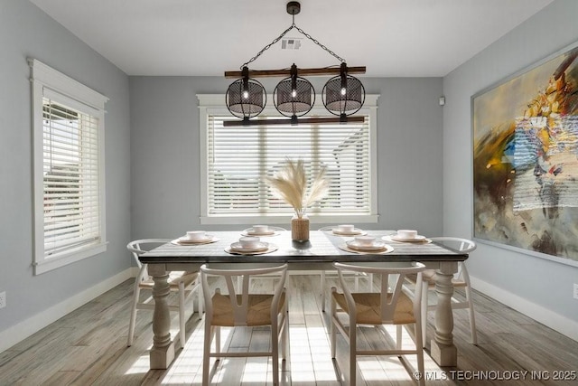 19021 E Chokeberry St, Owasso, OK 74055 - dining room with wood finished floors and baseboards