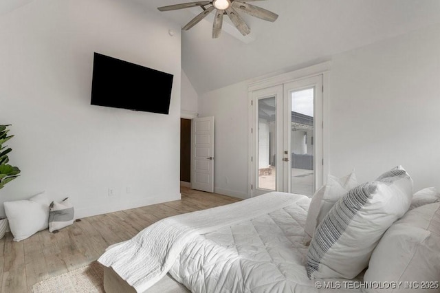19021 E Chokeberry St, Owasso, OK 74055 - bedroom featuring access to exterior, wood finished floors, vaulted ceiling, a ceiling fan, and french doors