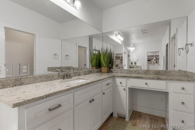 19021 E Chokeberry St, Owasso, OK 74055 - bathroom with vanity and wood finished floors
