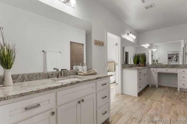 19021 E Chokeberry St, Owasso, OK 74055 - full bath featuring vanity and wood finished floors
