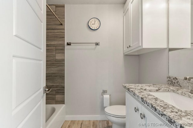 19021 E Chokeberry St, Owasso, OK 74055 - bathroom featuring vanity, wood finished floors, and shower / tub combination