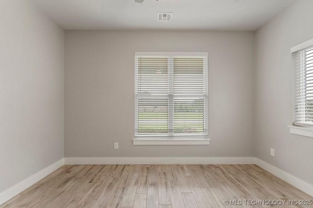 19021 E Chokeberry St, Owasso, OK 74055 - unfurnished room featuring healthy amount of natural light and wood finished floors